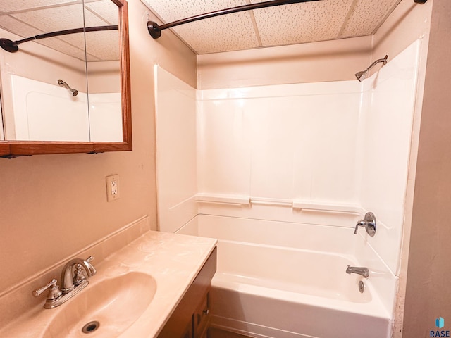 120 SW 2nd St Unit 1 & 2, Wentworth, SD 57075 - bathroom featuring shower / bath combination, a paneled ceiling, and vanity