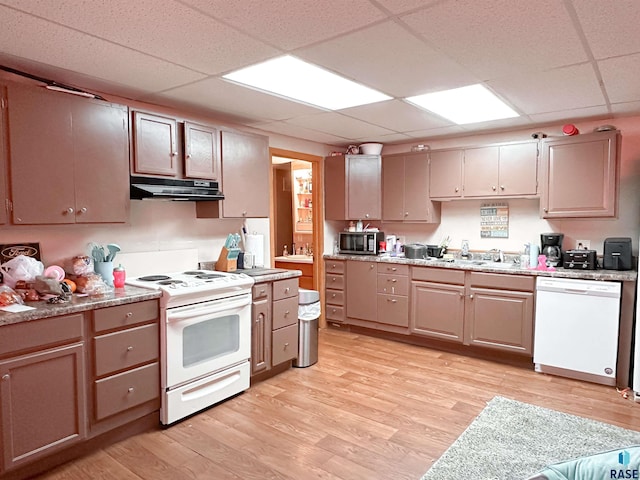 120 SW 2nd St Unit 1 & 2, Wentworth, SD 57075 - kitchen with a paneled ceiling, a sink, light wood-style floors, under cabinet range hood, and white appliances