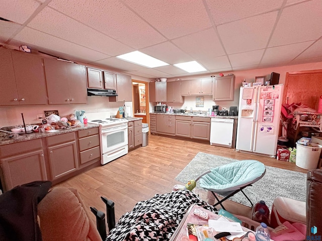 120 SW 2nd St Unit 1 & 2, Wentworth, SD 57075 - kitchen featuring white appliances, a drop ceiling, light countertops, under cabinet range hood, and a sink