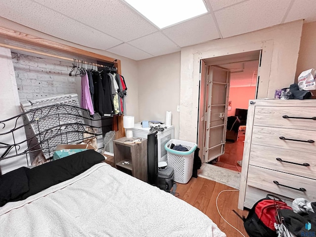 120 SW 2nd St Unit 1 & 2, Wentworth, SD 57075 - bedroom featuring a paneled ceiling and wood finished floors