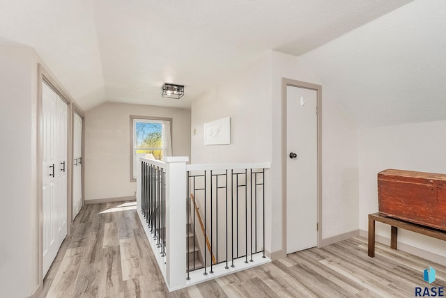 409 Boxelder St, Valley Springs, SD 57068 - bonus room featuring baseboards, light wood finished floors, and lofted ceiling