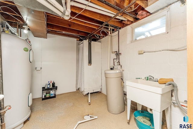409 Boxelder St, Valley Springs, SD 57068 - below grade area with a sink and electric water heater