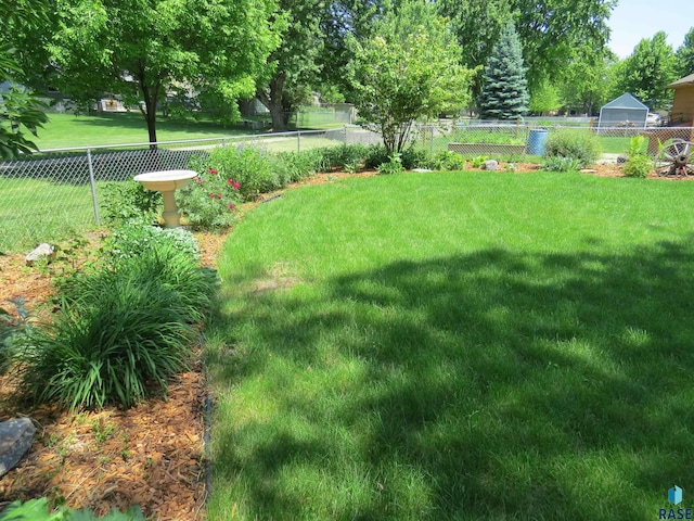 view of yard with a fenced backyard
