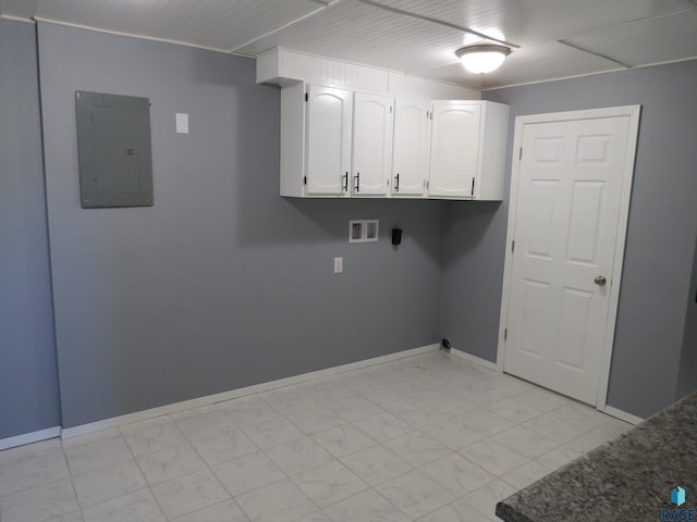 laundry room with marble finish floor, baseboards, hookup for a washing machine, electric panel, and cabinet space