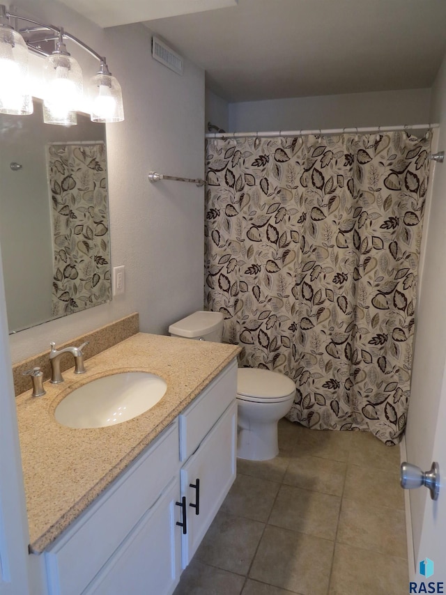 full bath featuring visible vents, tile patterned floors, toilet, and vanity