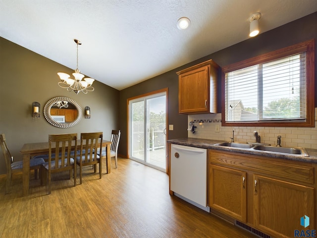 301 W Hackberry St, Brandon, SD 57005 - kitchen with a sink, tasteful backsplash, light wood-style floors, and dishwasher