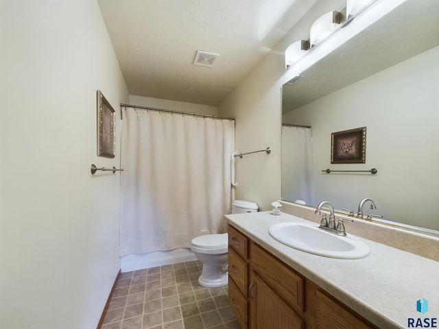 301 W Hackberry St, Brandon, SD 57005 - full bath featuring toilet, visible vents, tile patterned flooring, and vanity