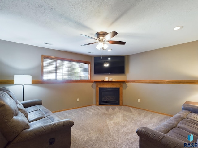 301 W Hackberry St, Brandon, SD 57005 - carpeted living area with a ceiling fan, visible vents, a fireplace, baseboards, and recessed lighting