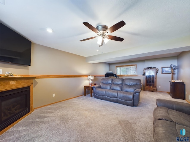 301 W Hackberry St, Brandon, SD 57005 - living area featuring baseboards, carpet, a glass covered fireplace, and ceiling fan