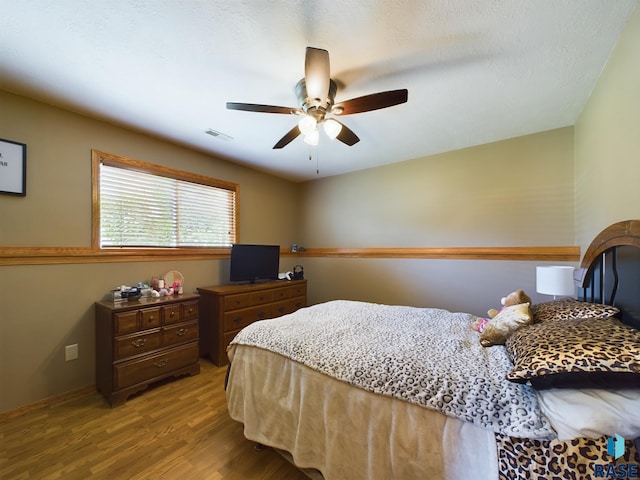301 W Hackberry St, Brandon, SD 57005 - bedroom featuring a ceiling fan, wood finished floors, and visible vents
