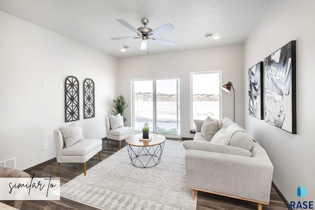5707 E Avett Pl, Sioux Falls, SD 57108 - living area featuring ceiling fan, visible vents, baseboards, and dark wood-type flooring