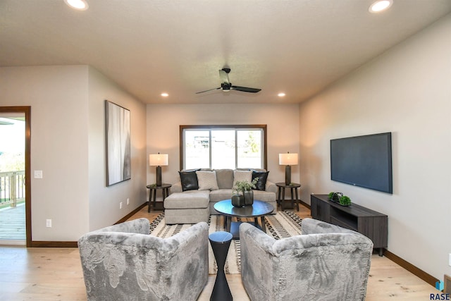 living room featuring recessed lighting, ceiling fan, baseboards, and light wood finished floors