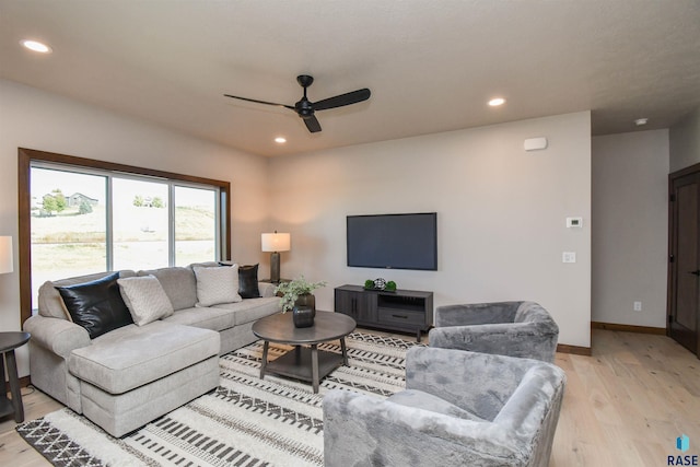 living area featuring a ceiling fan, recessed lighting, and light wood finished floors