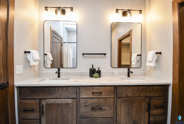 full bathroom featuring a sink and double vanity