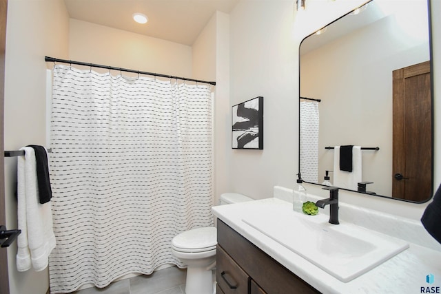 bathroom featuring toilet, a shower with curtain, and vanity
