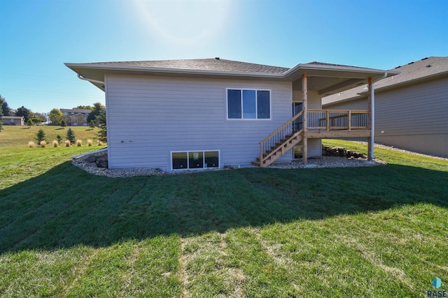 back of property with a lawn and stairway