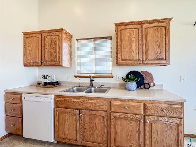 kitchen with a sink, light countertops, brown cabinetry, and dishwasher