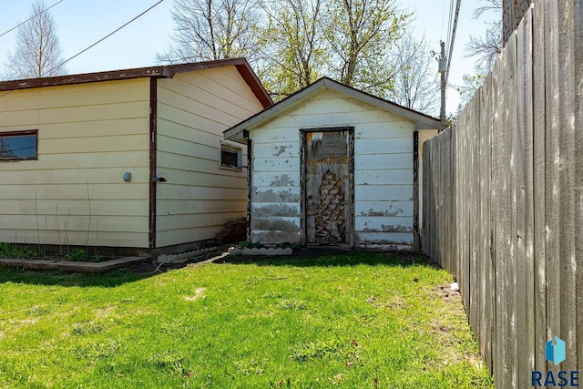 view of shed with fence