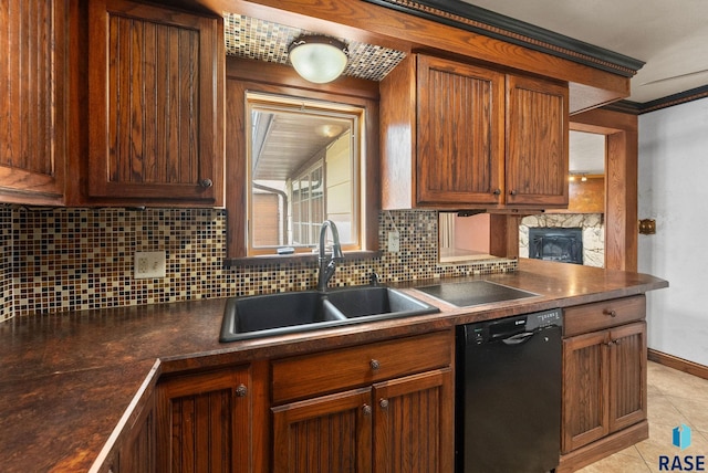 kitchen with backsplash, dark countertops, a sink, light tile patterned floors, and black dishwasher