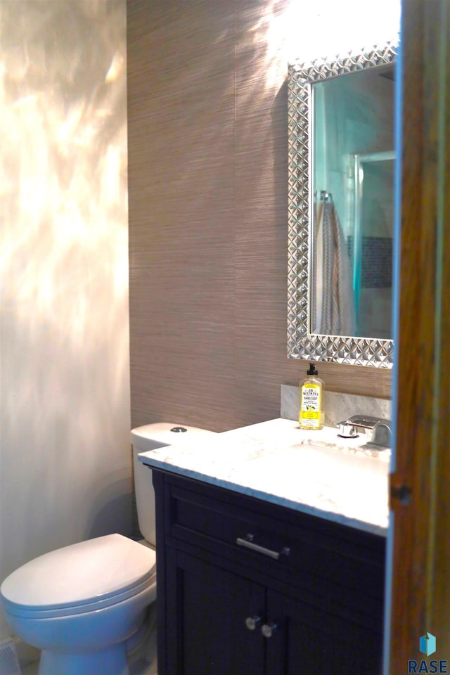 1408 N Tahoe Trl, Sioux Falls, SD 57110 - bathroom featuring an enclosed shower, toilet, and vanity