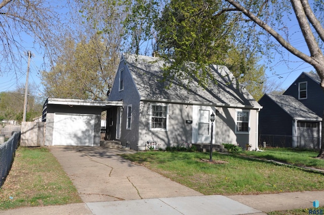 2911 S Norton Ave, Sioux Falls, SD 57105 - view of front of house with an attached garage, fence, driveway, and a front yard