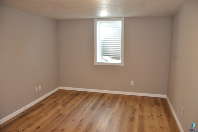 2911 S Norton Ave, Sioux Falls, SD 57105 - spare room with baseboards and wood finished floors