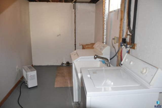 2911 S Norton Ave, Sioux Falls, SD 57105 - laundry room featuring washer and dryer and laundry area