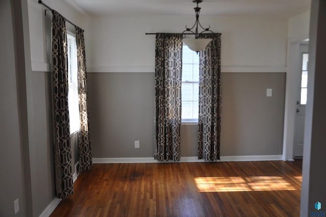 2911 S Norton Ave, Sioux Falls, SD 57105 - unfurnished dining area with baseboards, wood finished floors, and a wealth of natural light