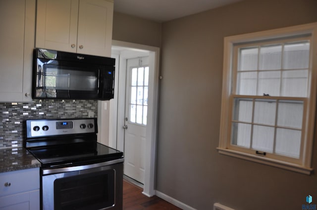 2911 S Norton Ave, Sioux Falls, SD 57105 - kitchen featuring stainless steel range with electric cooktop, black microwave, baseboards, decorative backsplash, and dark wood-type flooring