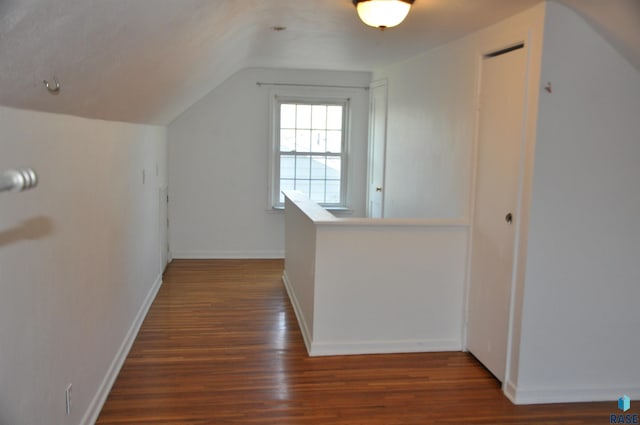 2911 S Norton Ave, Sioux Falls, SD 57105 - hall featuring baseboards, vaulted ceiling, and wood finished floors