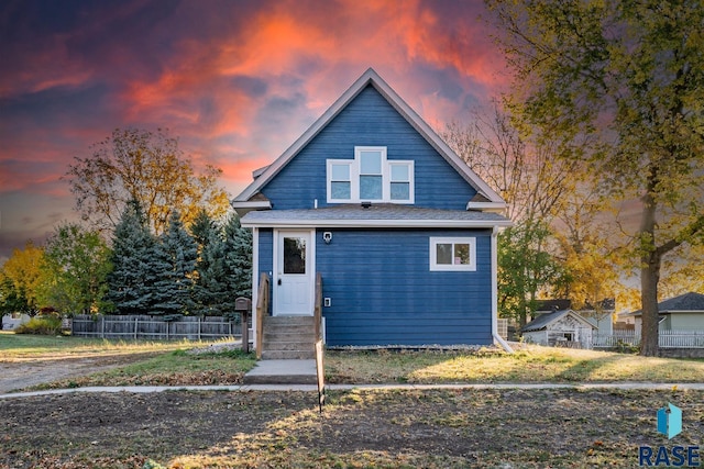 view of front of property featuring fence and entry steps