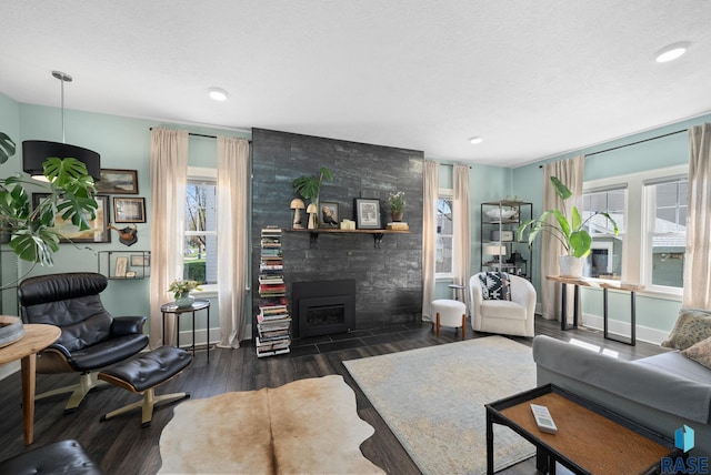 living room with plenty of natural light, recessed lighting, and wood finished floors