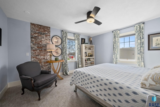 bedroom featuring baseboards, carpet flooring, ceiling fan, and multiple windows