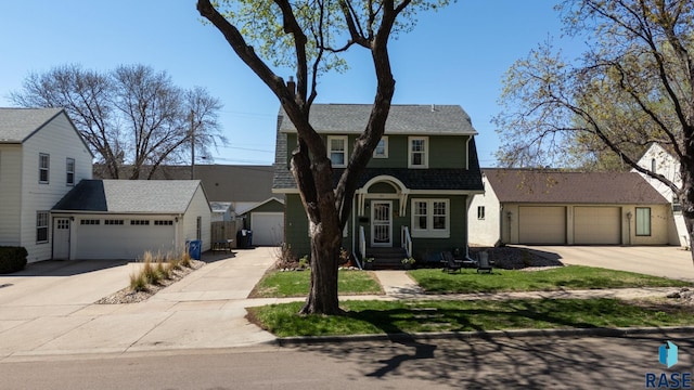 view of front of house with a garage and roof with shingles