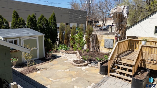 view of patio / terrace featuring a deck and stairs