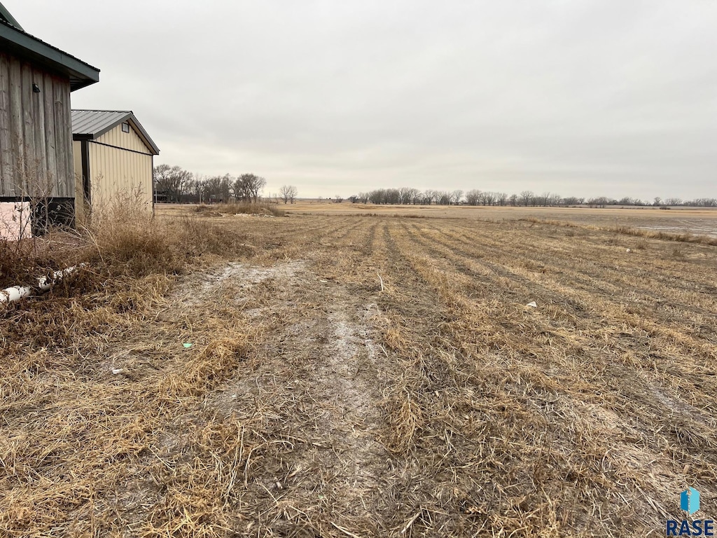 view of yard with a rural view