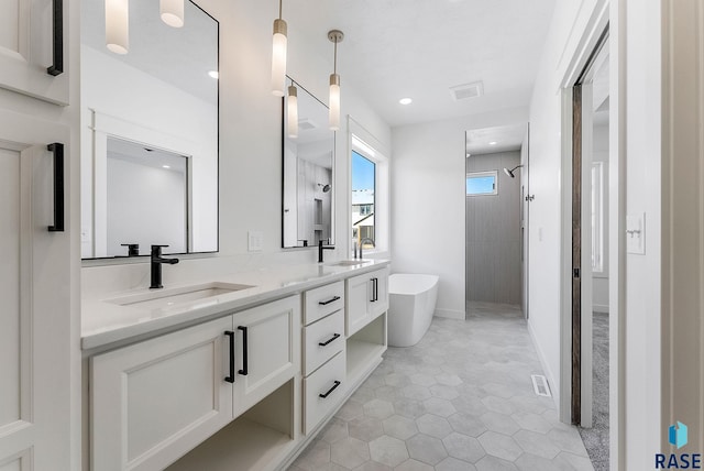 2700 N Vermillion Cir, Tea, SD 57064 - bathroom featuring a sink, a freestanding bath, tiled shower, and visible vents
