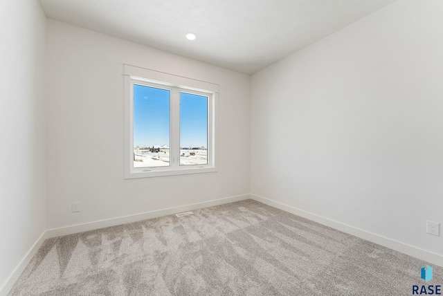 2700 N Vermillion Cir, Tea, SD 57064 - spare room with baseboards and carpet