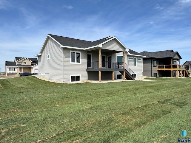2700 N Vermillion Cir, Tea, SD 57064 - rear view of house featuring a lawn, a wooden deck, and stairway
