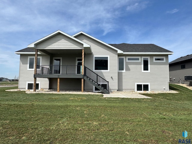 2700 N Vermillion Cir, Tea, SD 57064 - rear view of property featuring a yard, stairway, and a shingled roof