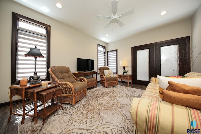 living area featuring baseboards, recessed lighting, a ceiling fan, and wood finished floors