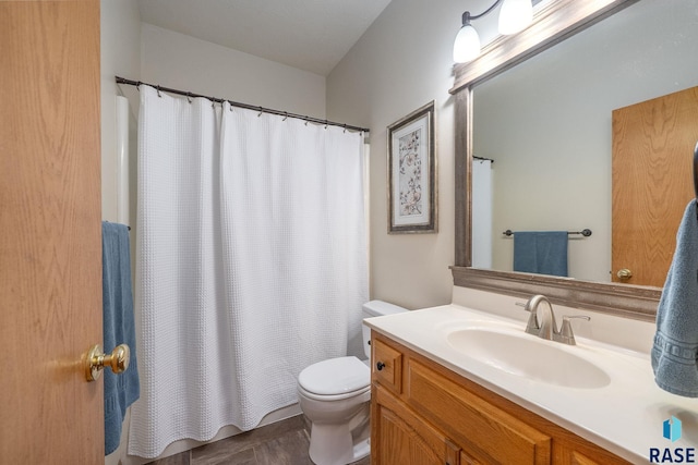 5215 E Belmont St, Sioux Falls, SD 57110 - full bathroom with vanity, a shower with curtain, and toilet