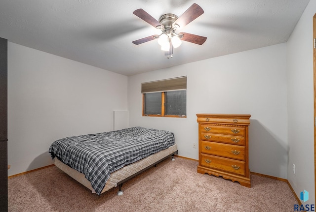5215 E Belmont St, Sioux Falls, SD 57110 - bedroom featuring a ceiling fan, baseboards, and light colored carpet