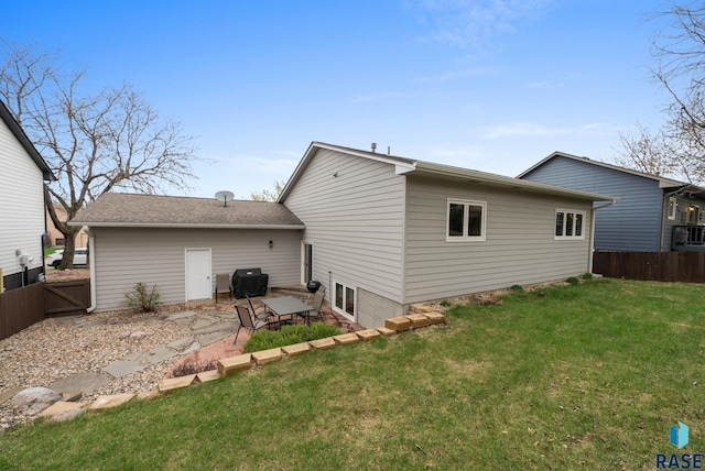 5215 E Belmont St, Sioux Falls, SD 57110 - back of property featuring a lawn, a patio area, and fence