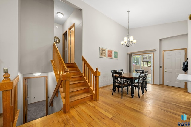 5215 E Belmont St, Sioux Falls, SD 57110 - dining space with light wood-style floors, stairs, and a notable chandelier