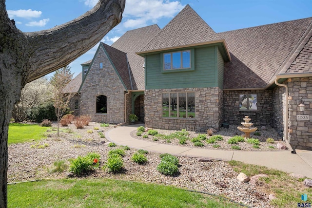 1705 N Deer Hollow Cir, Sioux Falls, SD 57110 - english style home featuring roof with shingles and stone siding