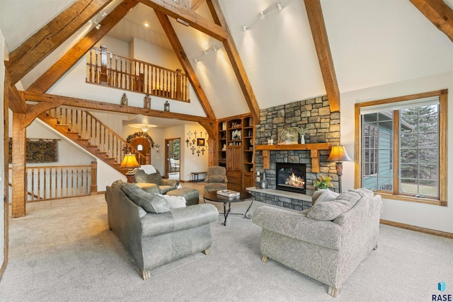 1705 N Deer Hollow Cir, Sioux Falls, SD 57110 - carpeted living area with high vaulted ceiling, plenty of natural light, beamed ceiling, and baseboards