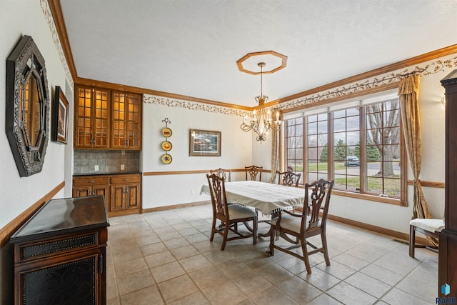 1705 N Deer Hollow Cir, Sioux Falls, SD 57110 - dining space featuring baseboards, ornamental molding, and a notable chandelier