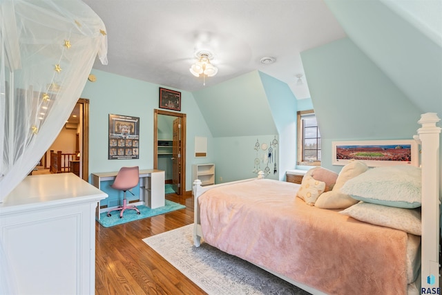 1705 N Deer Hollow Cir, Sioux Falls, SD 57110 - bedroom with baseboards, a ceiling fan, vaulted ceiling, and wood finished floors