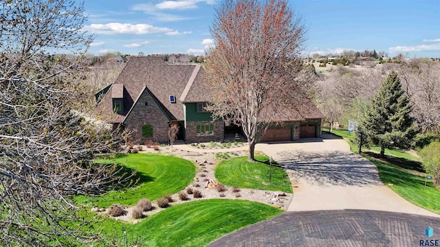 1705 N Deer Hollow Cir, Sioux Falls, SD 57110 - tudor home with concrete driveway and a front yard